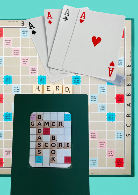 <img src="Bad Ass Gamer Scorebook.jpg" alt="A4 dark green cover scorebook with bad ass gamer score book design in scrabble letters on front cover">