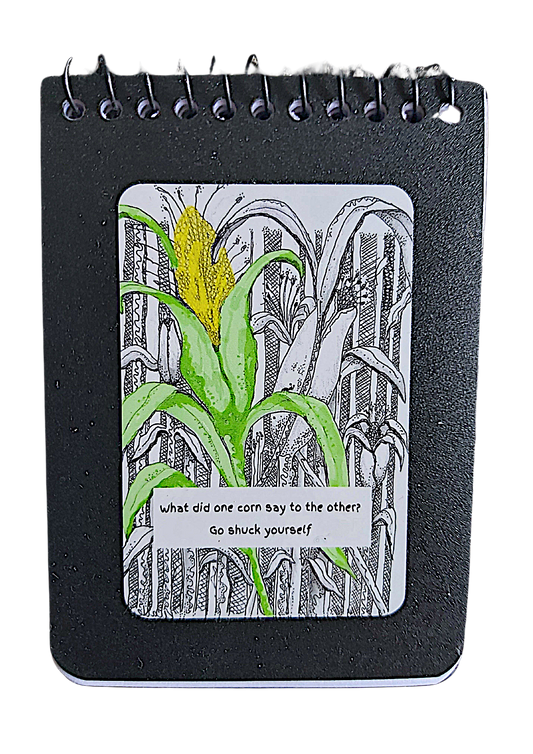 <img src="Go Shuck yourself-notepad.jpg" alt="small A7 size notepad with black ink cornfield with one green stalk and yellow corn cob">