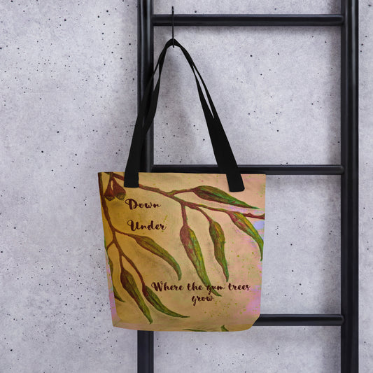 beige colour tote bag with green reddish brown branches of green gum leaves with the words Down Under, where the gum trees grow