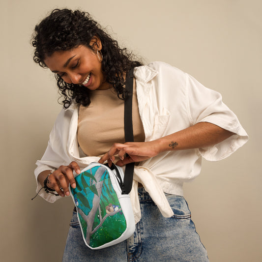 <img src="fairy wren birds in gum tree-cross body bag.jpg" alt="Handy cross body bag with original artwork of fairy wrens cuddling in gum tree with turquoise green colours">