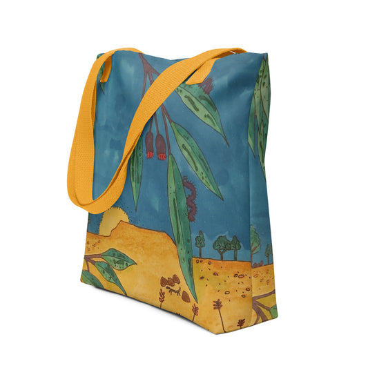 <img src="outback art tote bag.jpg" alt="outback artwork of blue sky and sandy ground with big rock surrounded by native Australian gum leaf flora in foreground">