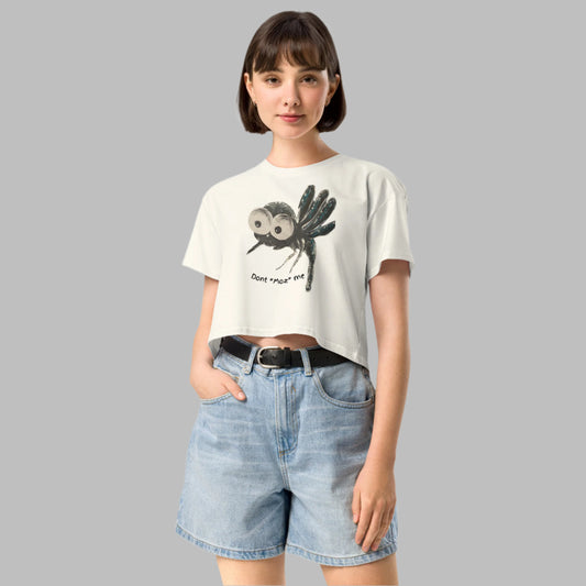 <img src="womens crop short sleeve jumper.jpg" alt="light colour crop tshirt with cartoon like mozzie with big eyes design">
